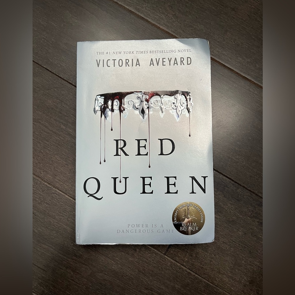 Red Queen Softcover book by Victoria Aveyard 
(Young Adult, Fantasy Fiction)